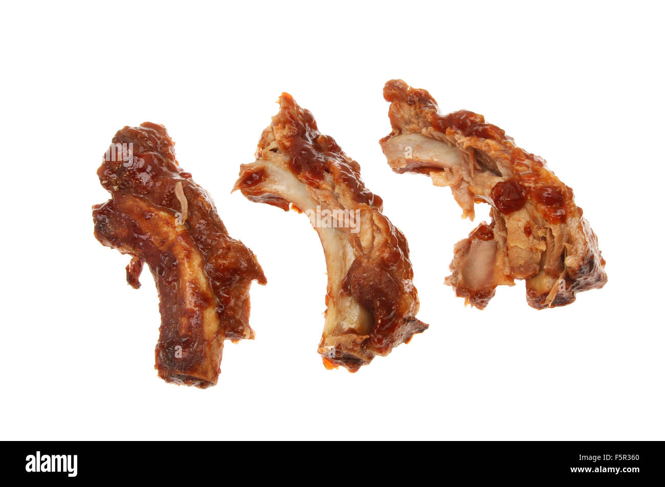 Pork spare ribs with barbecue sauce isolated against white Stock Photo