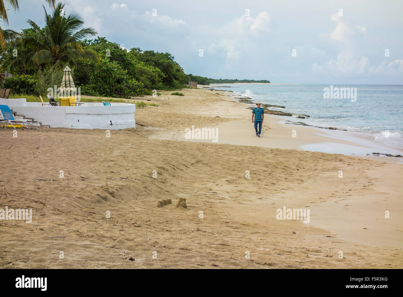 A Caucasian Senior Man Walks Sancastle Beach In St Croix U S