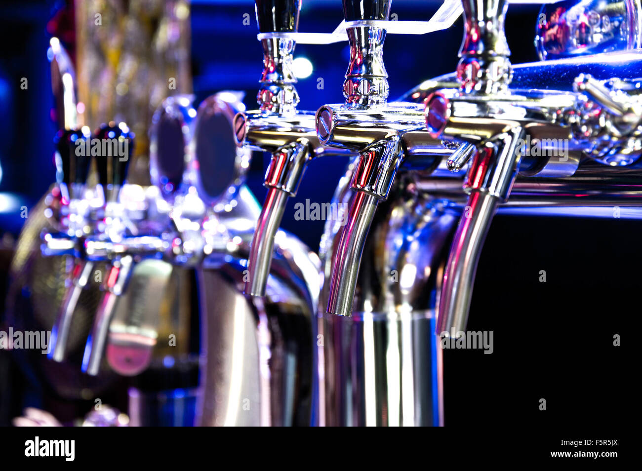 Alcohol conceptual image. Beer dispenser in the bar. Stock Photo
