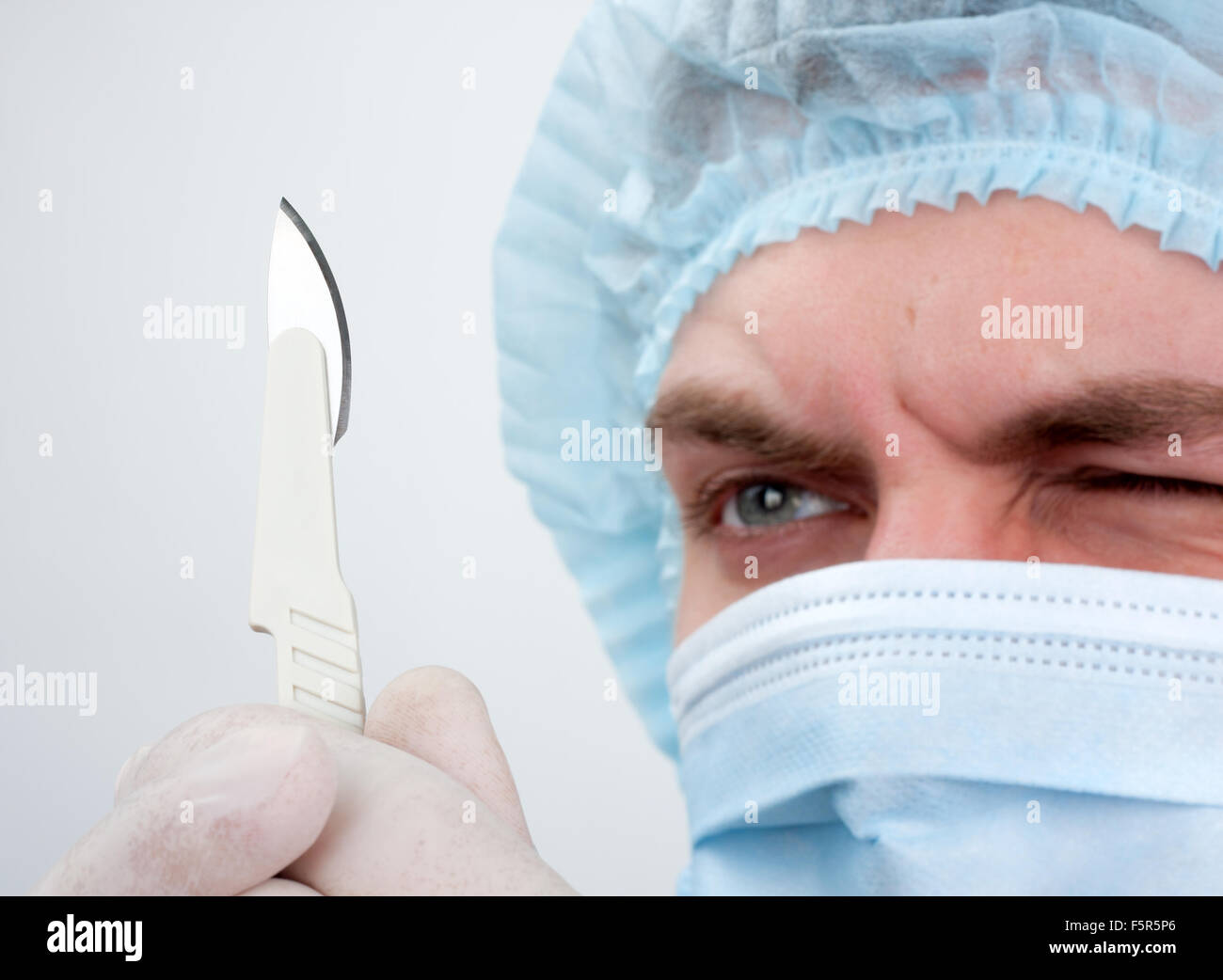 Portrait of serious surgeon with surgical knife Stock Photo Alamy