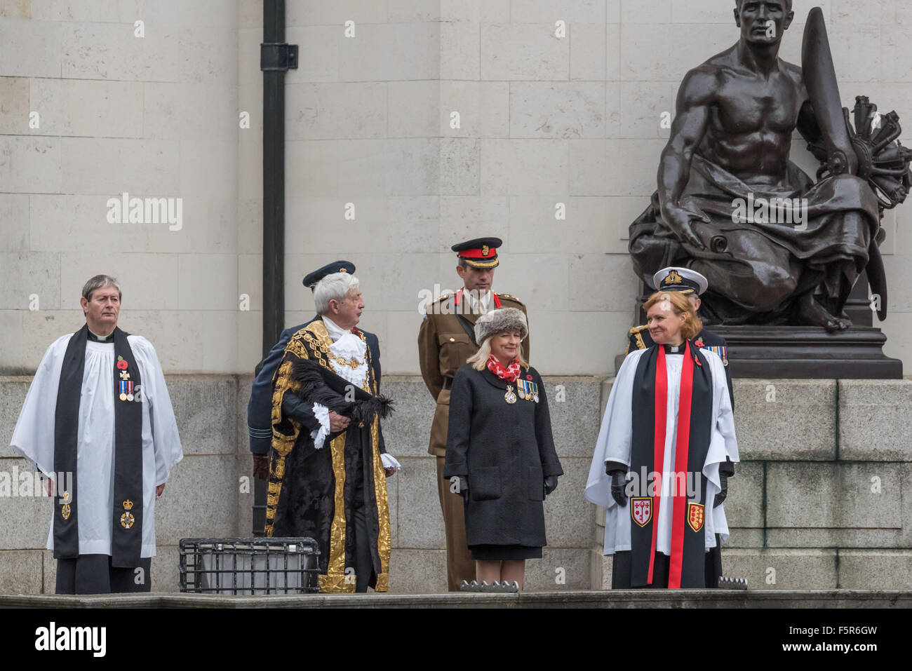 Birmingham, UK. 8th November, 2015. The Lord Mayor of Birmingham Councillor Raymond Hassall, Chaplain The Reverend Victor Van Den Bergh and the Dean of Birmingham The Very Reverend Catherine Ogle at the Day Of National Remembrance Centenary Square Birmingham UK Credit:  David Holbrook/Alamy Live News Stock Photo