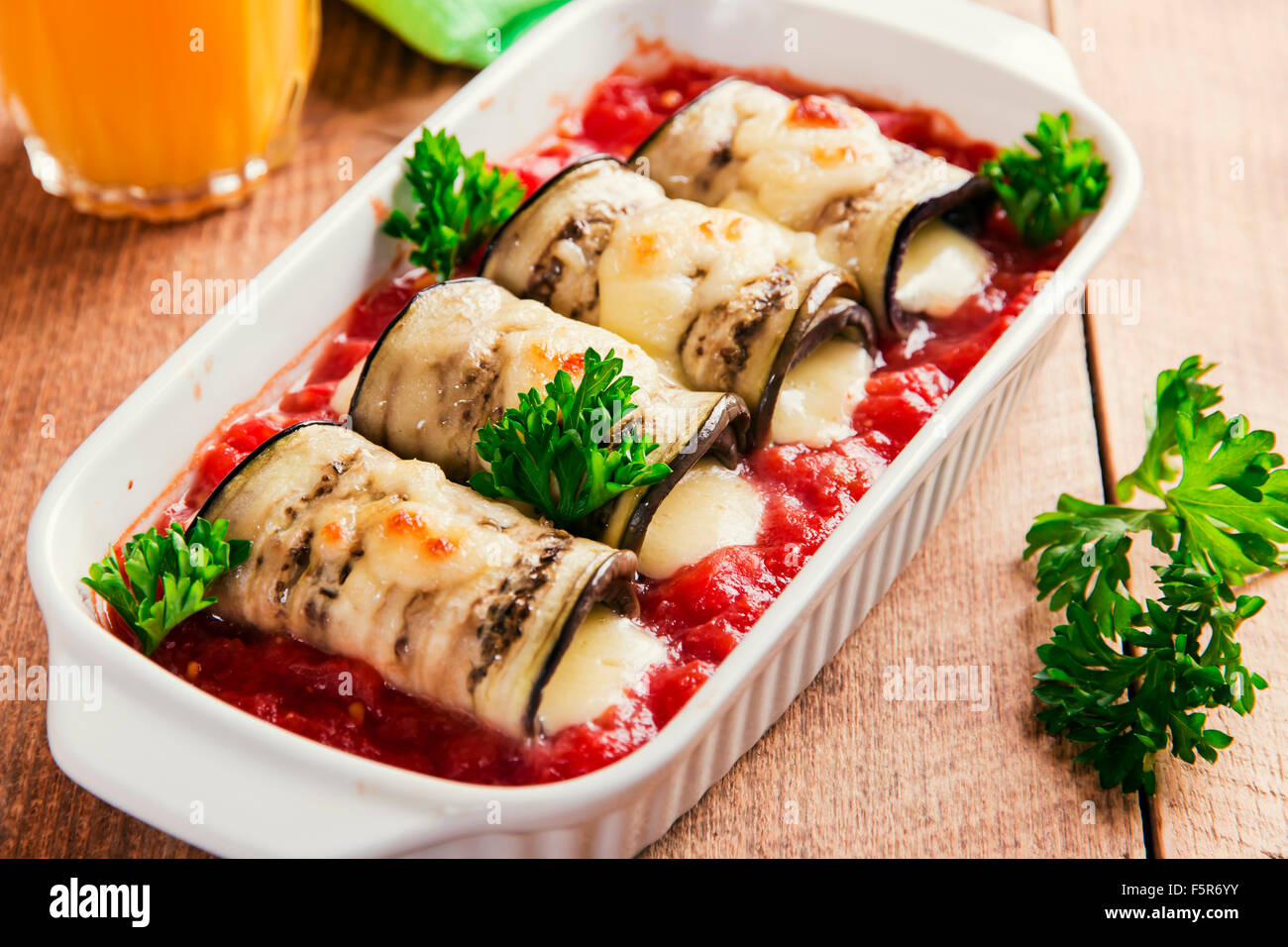 Baked eggplant with tomato sauce and cheese roll Stock Photo