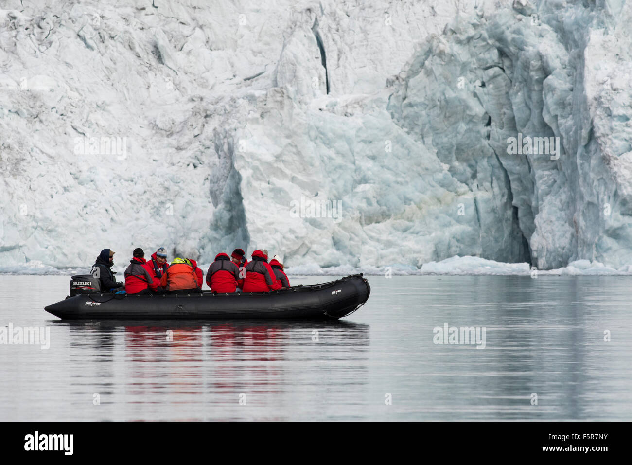 Norway, Svalbard, Spitsbergen, Hornsund, Burgerbukta. Exploring scenic glacier by zodiac boat. Stock Photo