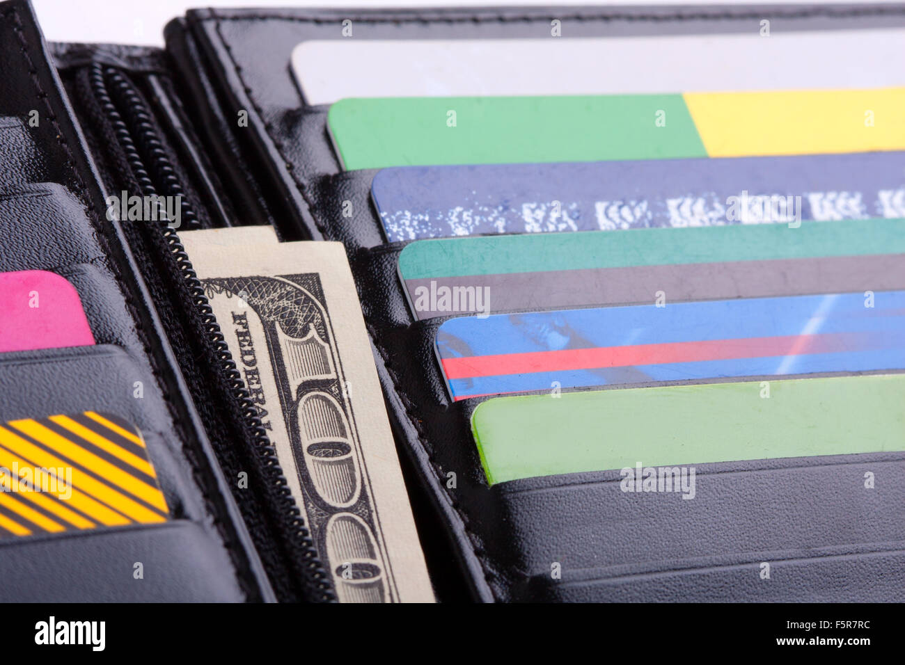 Black leather wallet with credit cards and money Stock Photo - Alamy