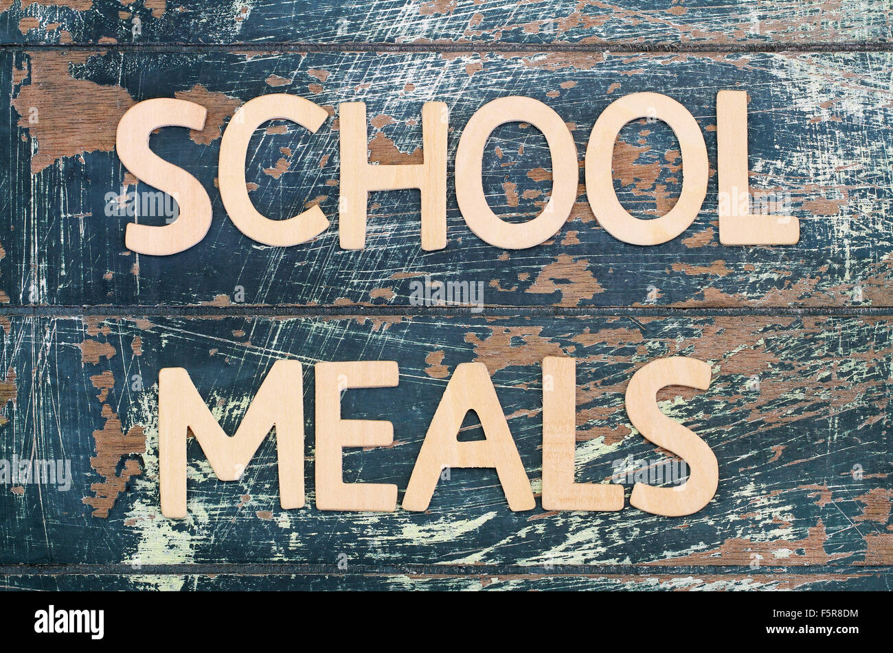 School meals written with wooden letters on rustic surface Stock Photo ...