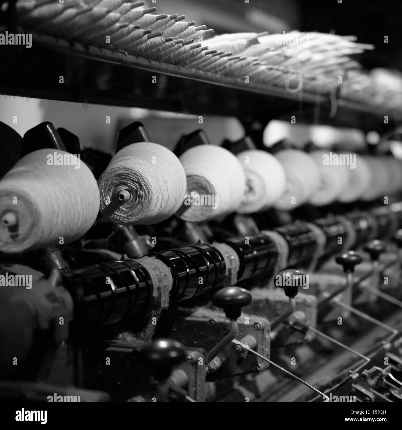 Cotton reels used in the weaving process Stock Photo