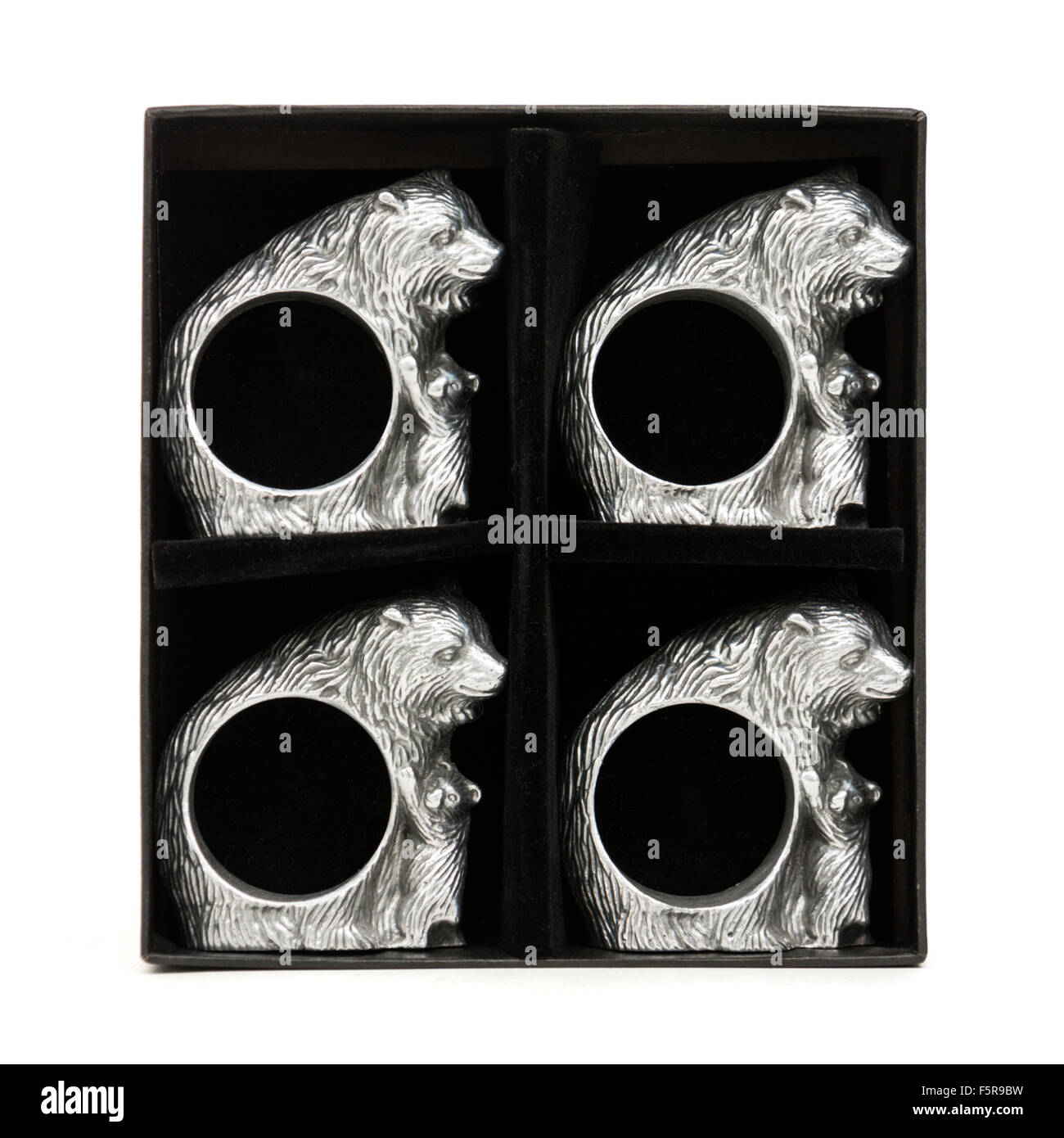 Set of four Arthur Court cast aluminium 'Bear and Cubs' napkin rings Stock Photo