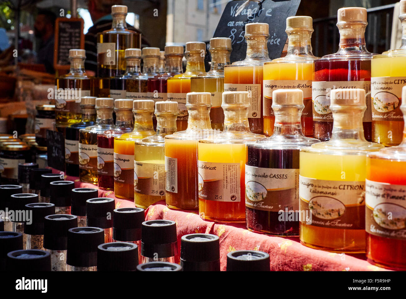 Bottles with vinegar at a market in Aups, Provence, France Stock Photo