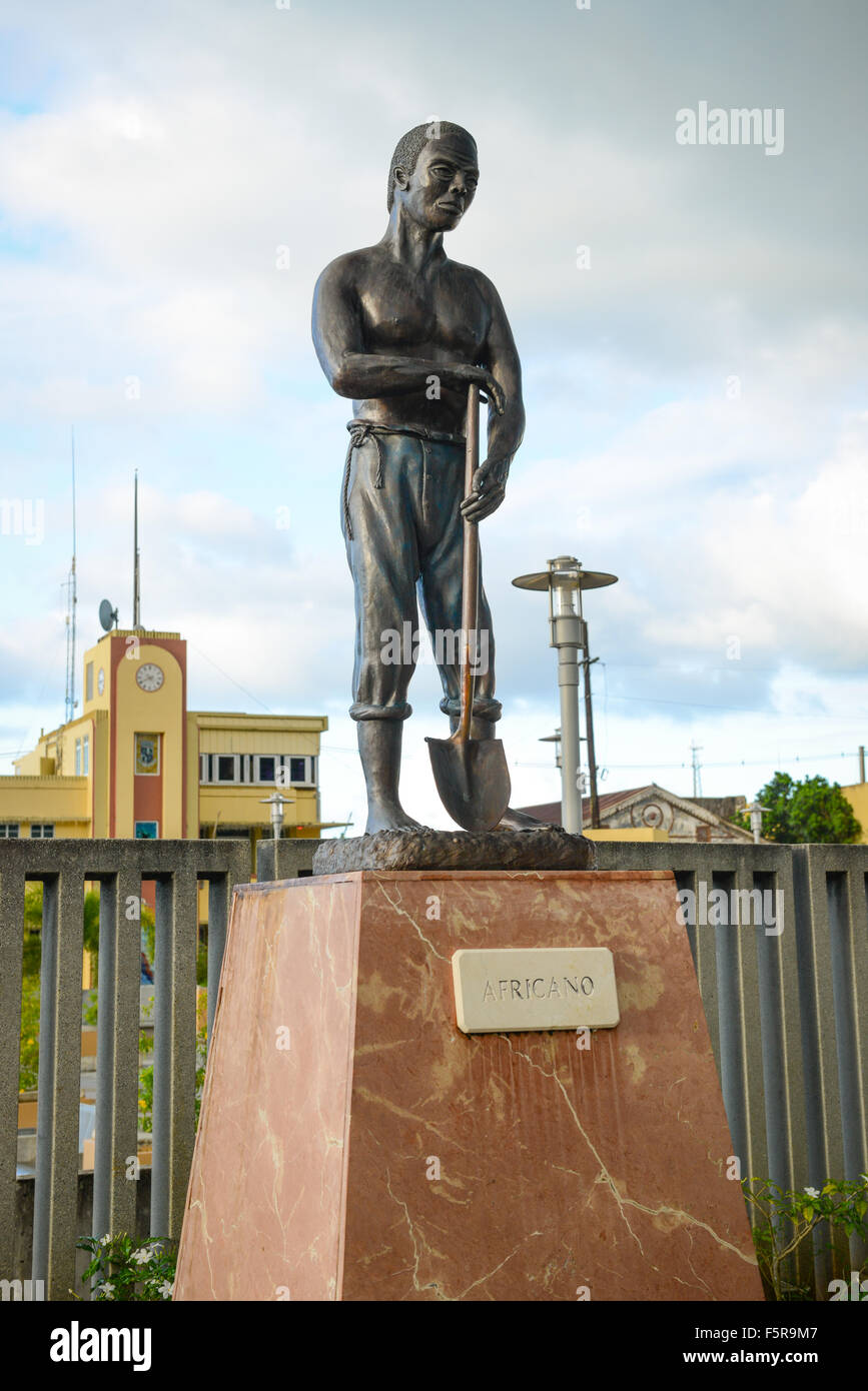 Statue of an African man in the plaza of the town of Manati, Puerto Rico. USA territory. Caribbean Island Stock Photo