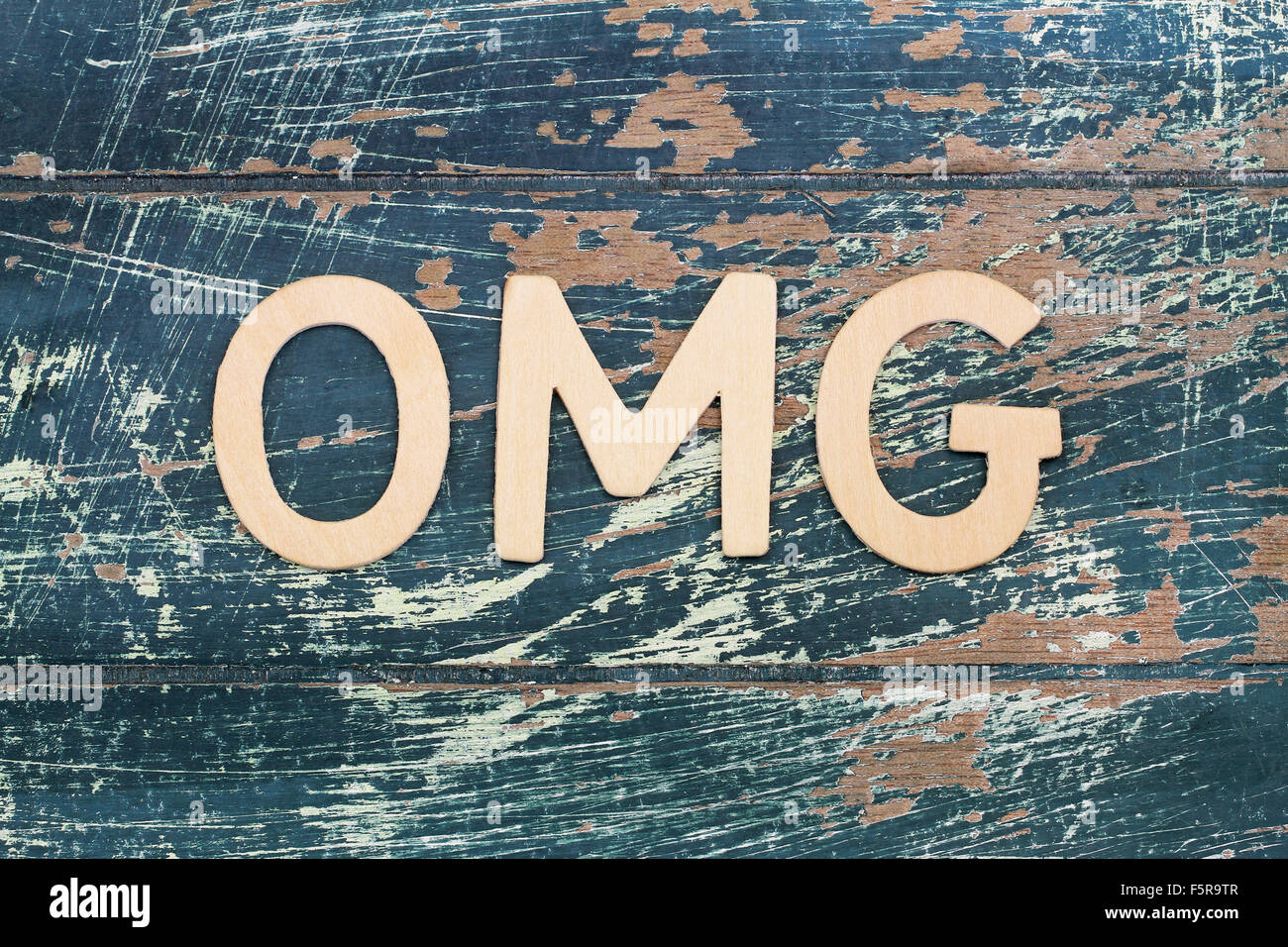 OMG letters on rustic wooden surface Stock Photo