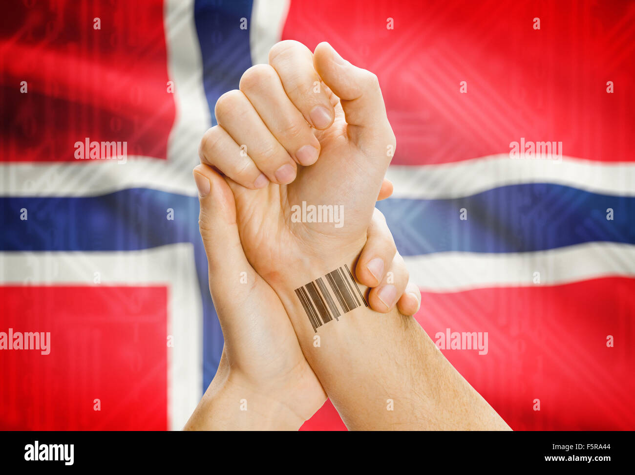 Barcode ID number on wrist of a human and national flag on background - Norway Stock Photo