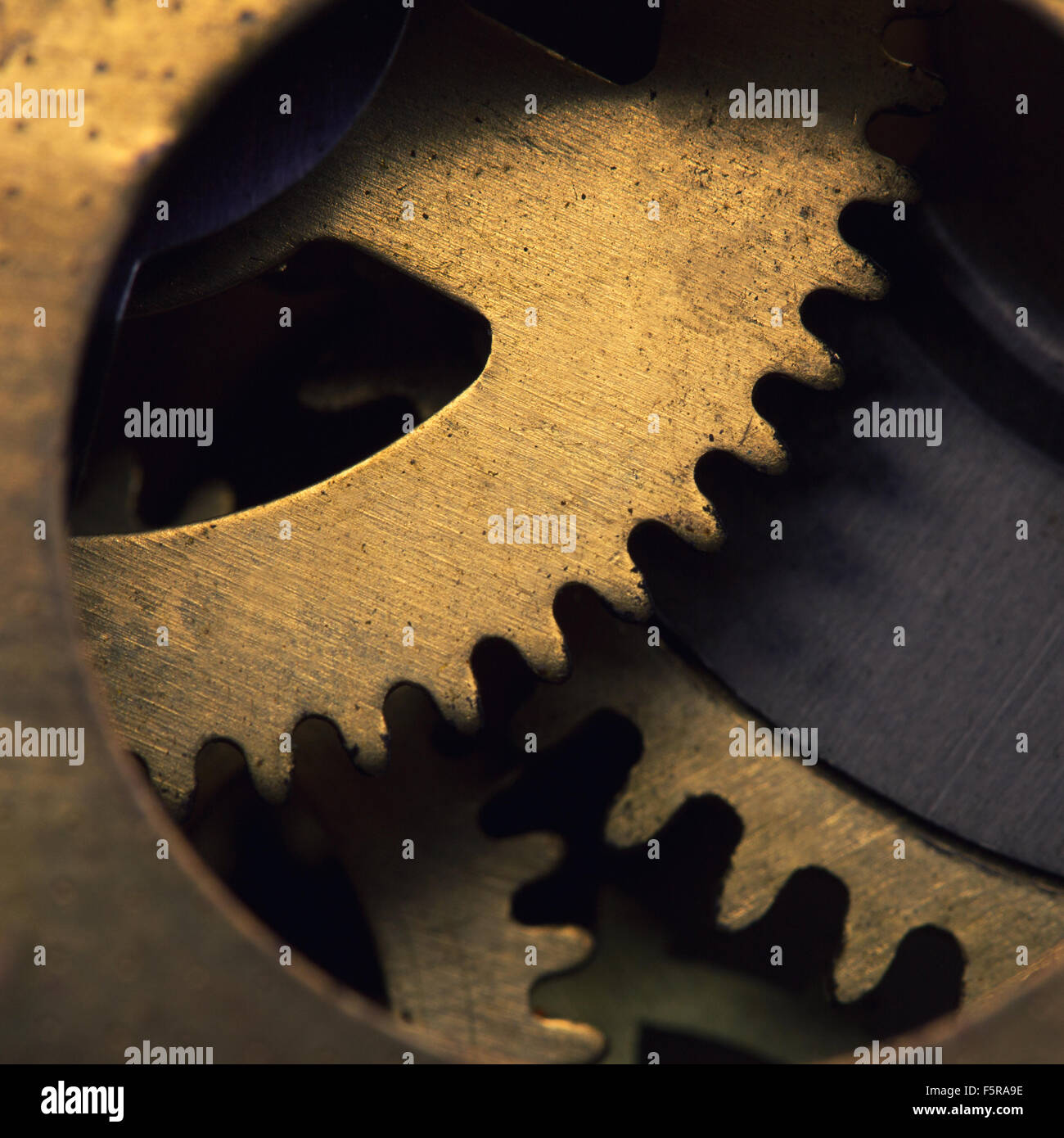 Closeup of gears inside old clock mechanism Stock Photo