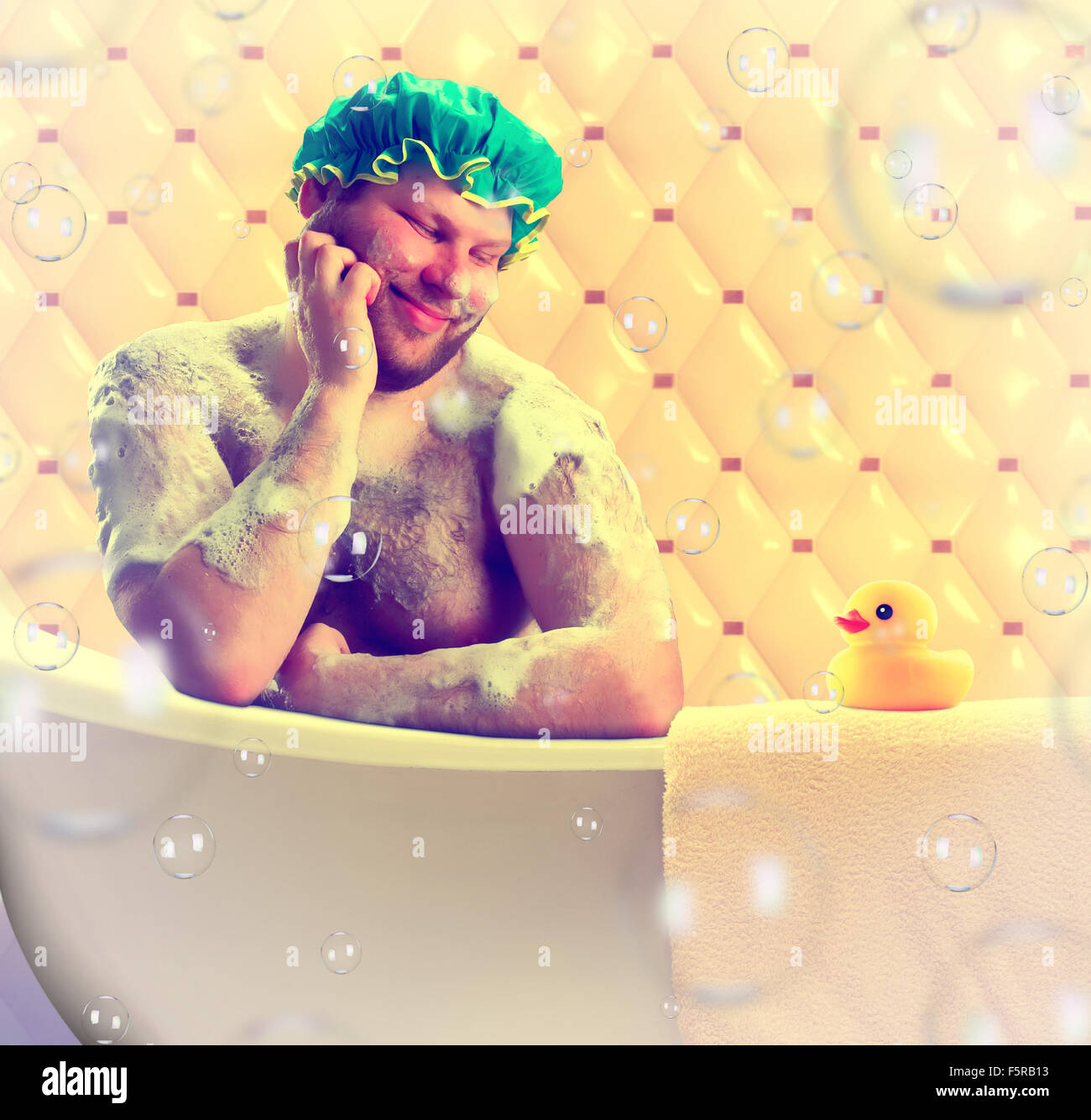 Romantic dreamer taking bath with toy duck Stock Photo