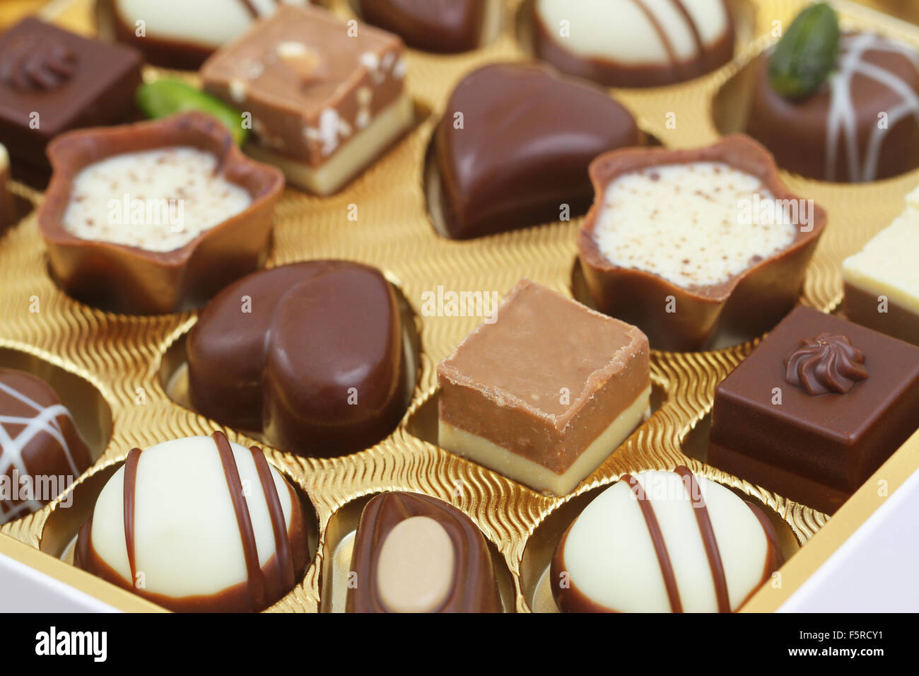 Assorted white and milk chocolates, closeup Stock Photo Alamy