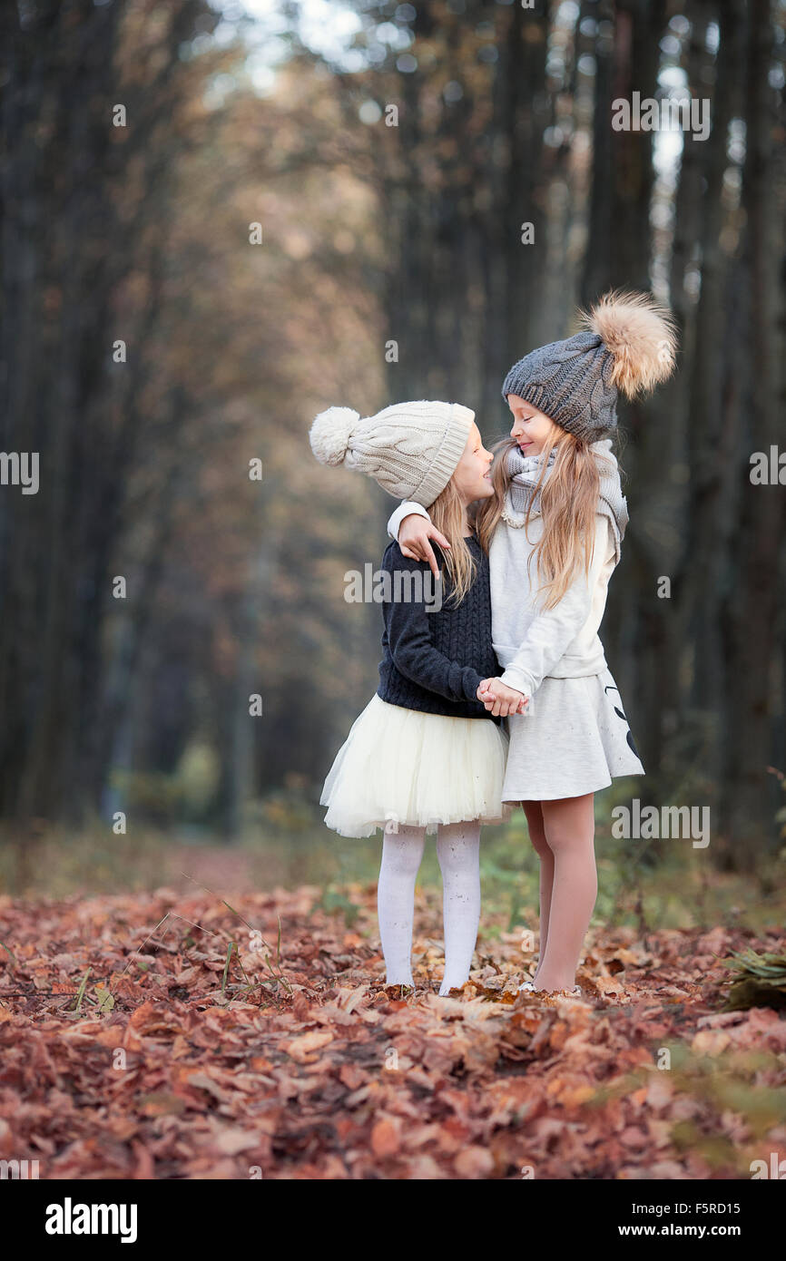 Little adorable girls at warm sunny autumn day outdoors Stock Photo - Alamy