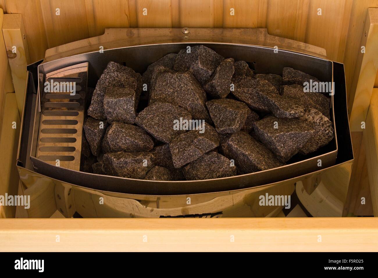 Lava stones on the sauna stove Stock Photo