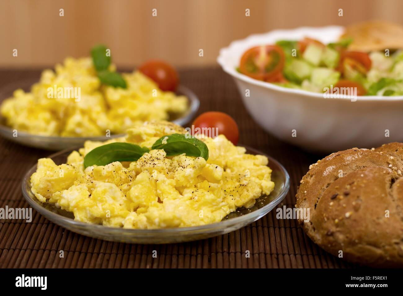 scrambled eggs with bread and vegetables (shallow DOF Stock Photo - Alamy