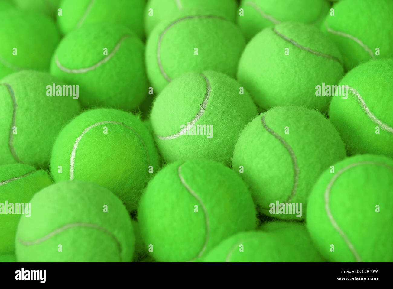 exotic green tennis ball as sport background Stock Photo - Alamy