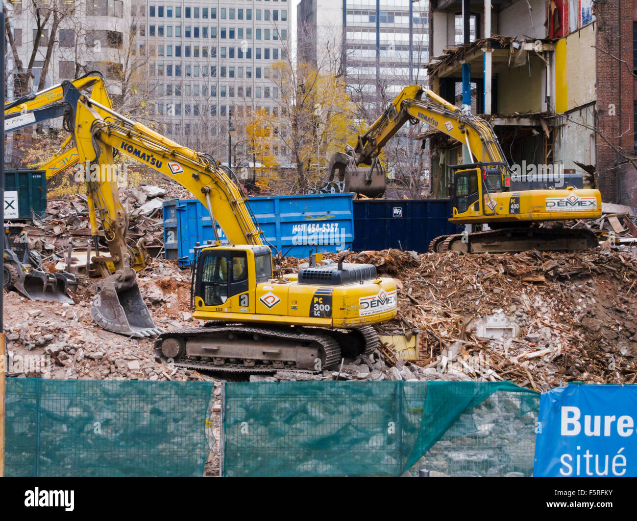 Komatsu PC300LC and PC400LC excavators at a demolition site in Montreal, Quebec, Canada. Stock Photo