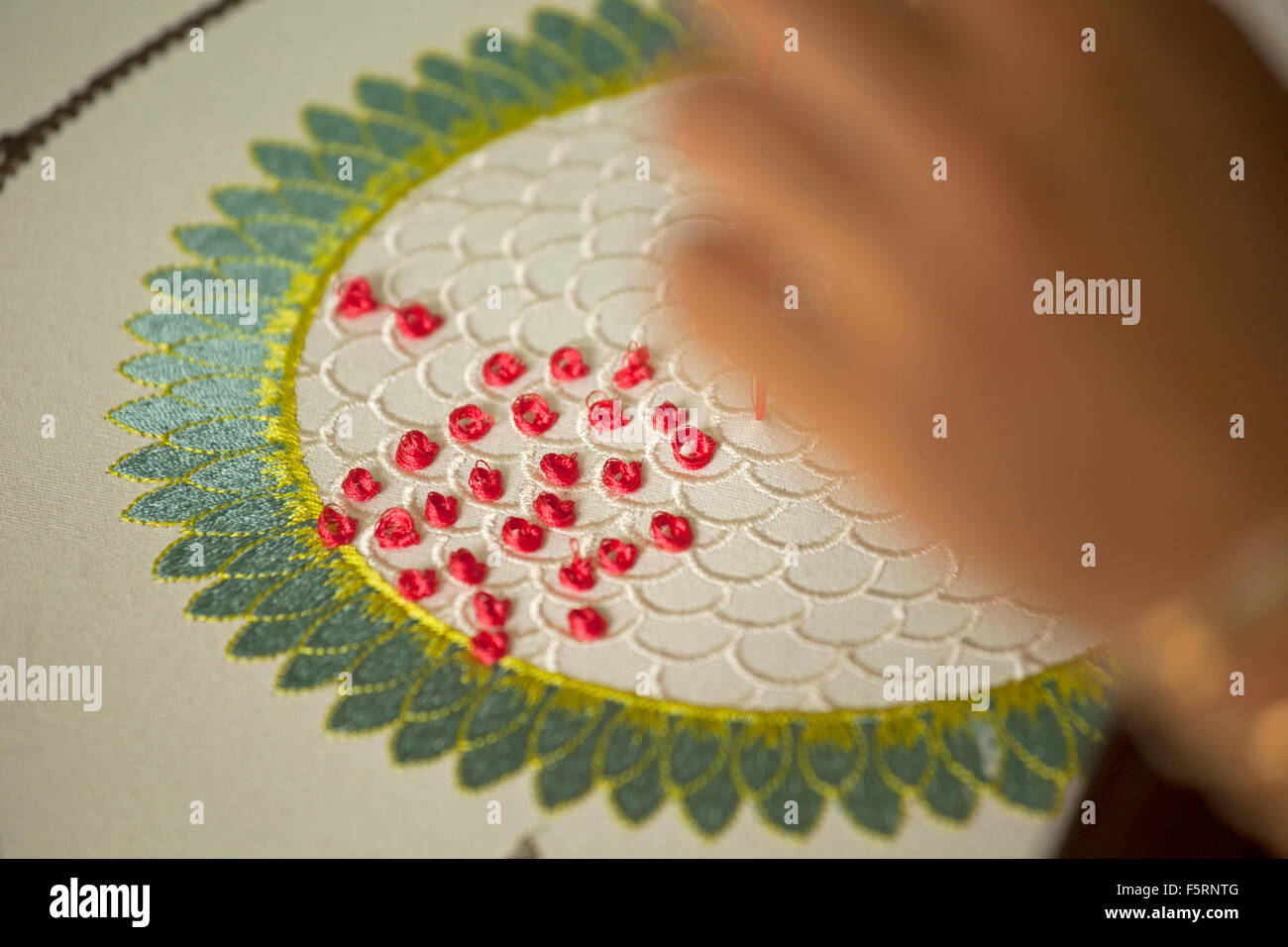 Traditional hand embroidering on fabric using threads Stock Photo Alamy