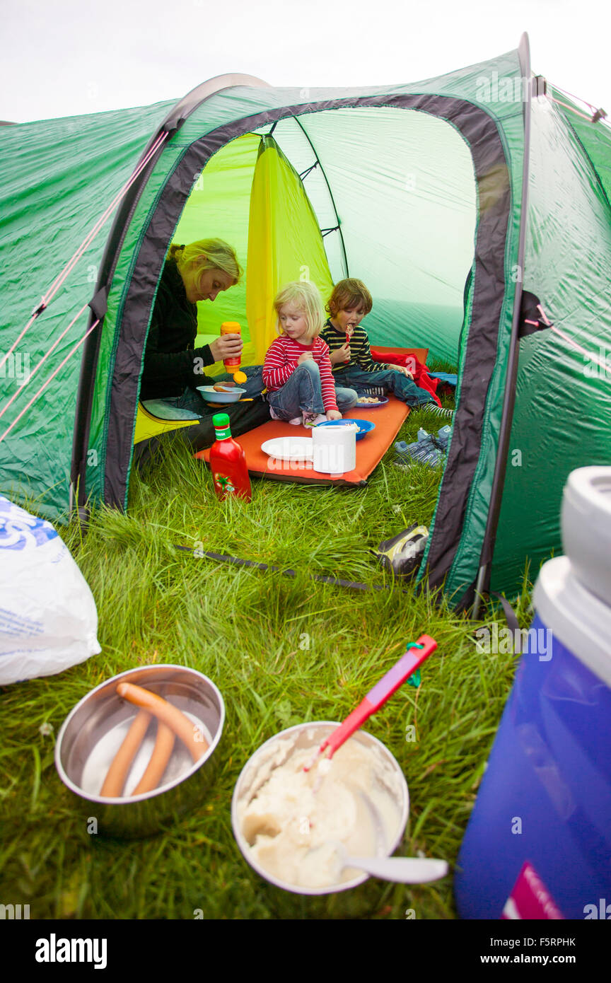Sweden, Bohuslan, Smogen, Woman with her two children (4-5, 6-7) camping Stock Photo