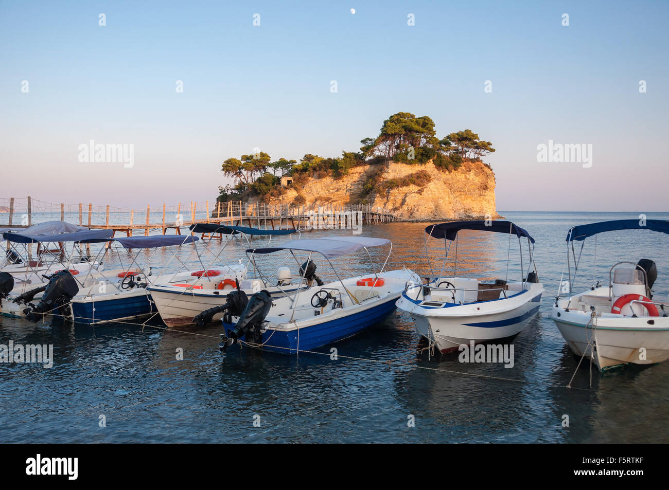 Boats at Cameo Island at sunset, Zakynthos, Greece Stock Photo Alamy