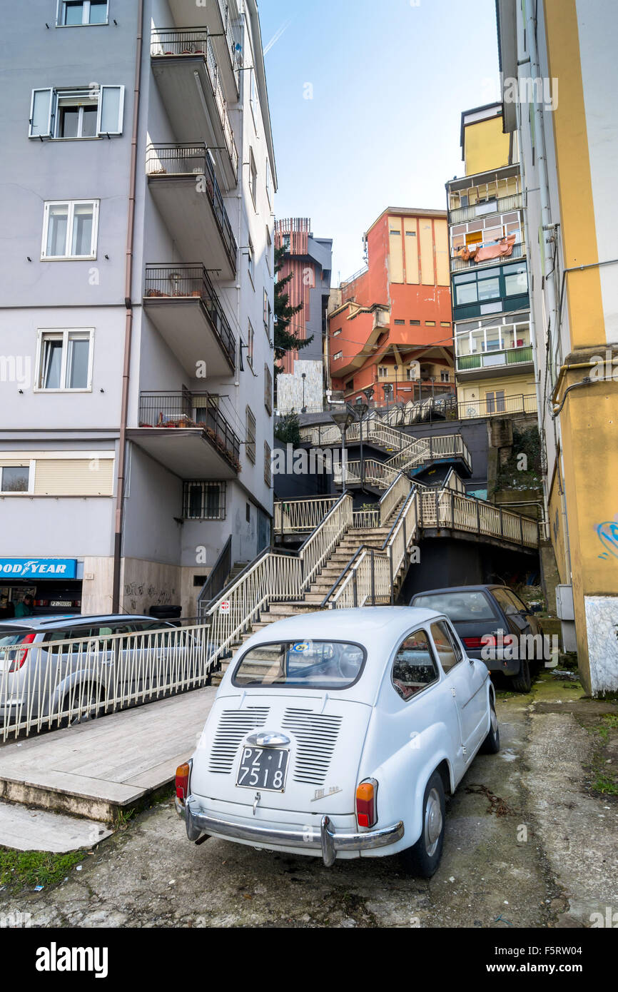 downtown street and old FIAT 600 car in Potenza, Italy. Stock Photo