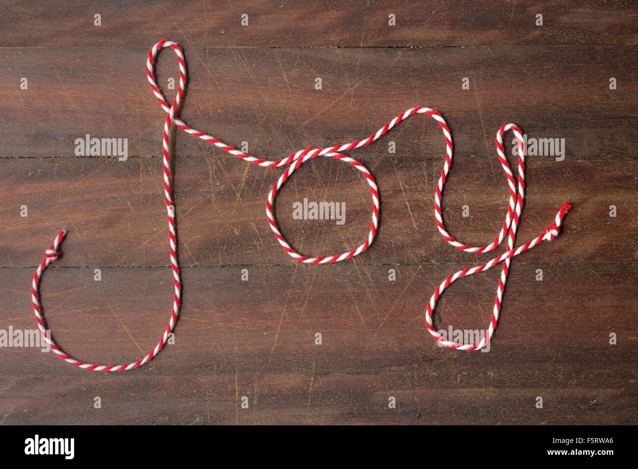 red xmas string spelling the word "joy Stock Photo Alamy