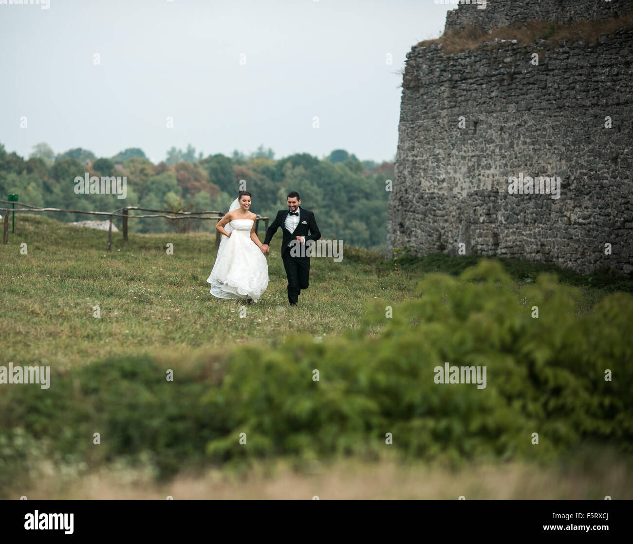Bride and groom walking away hi-res stock photography and images - Alamy