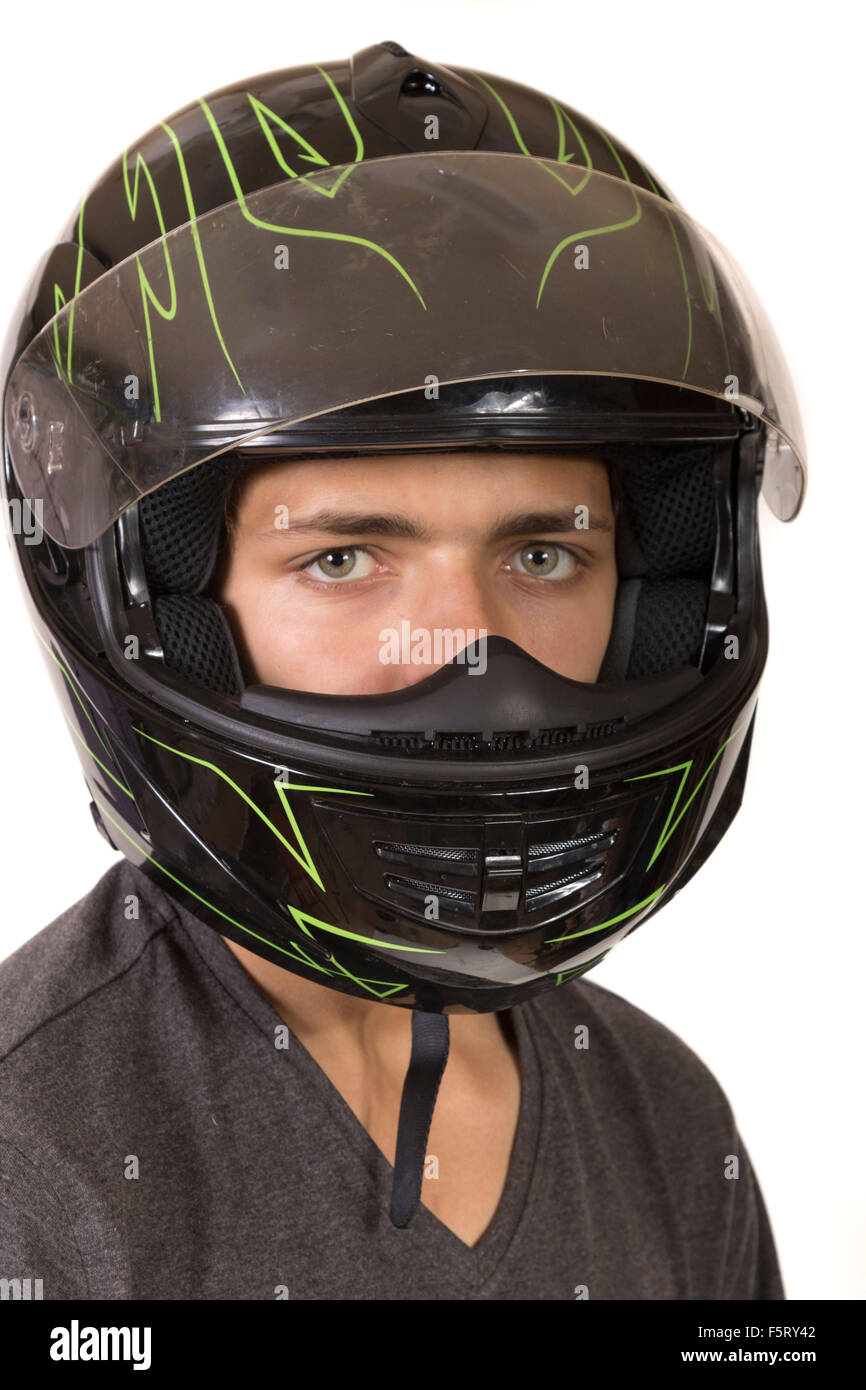 Teenage boy wearing a crash helmet Stock Photo Alamy