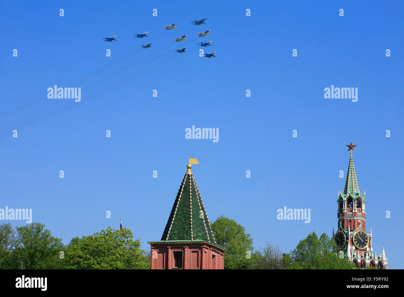 Russian Air Force fighters (Su-34, Su-24, Su-27 and MiG-29) flying in formation during the Victory Day Parade in Moscow, Russia Stock Photo