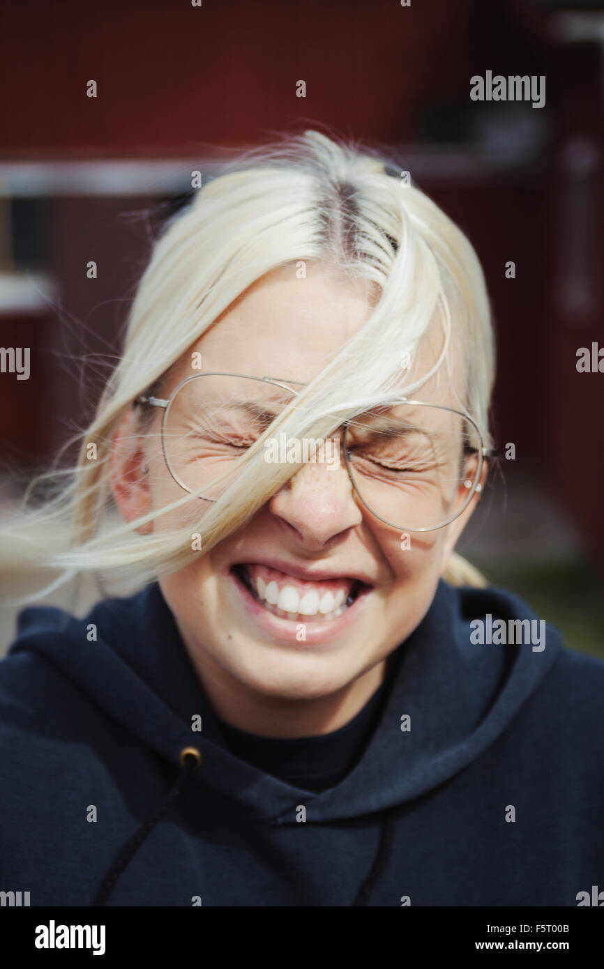Sweden, Smaland, Portrait of grinning woman Stock Photo