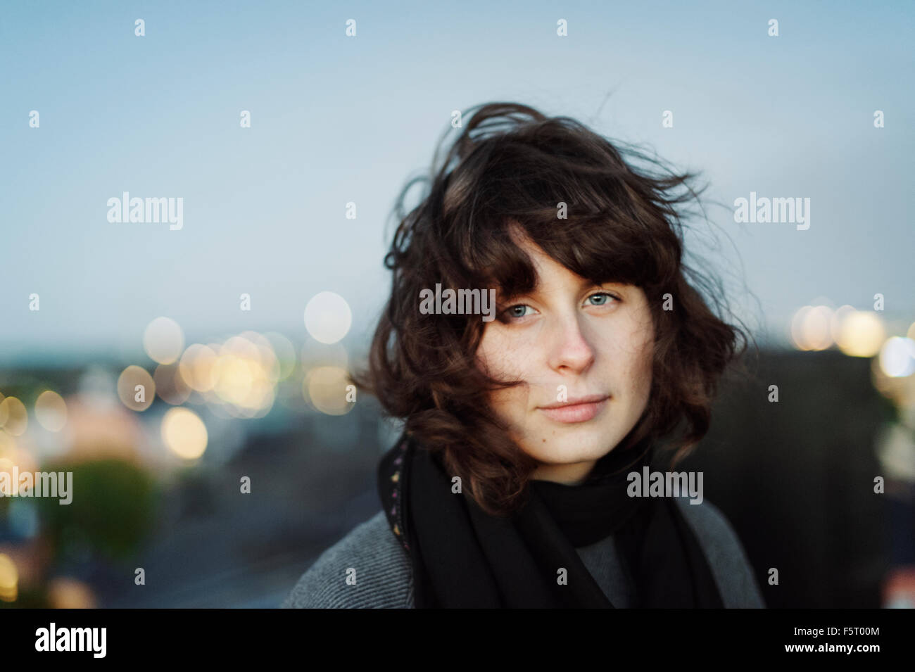Sweden, Sodermanland, Portrait of young woman at dusk Stock Photo