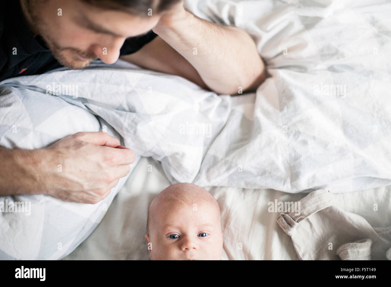 Sweden, Man looking at baby boy (0-1 months) Stock Photo