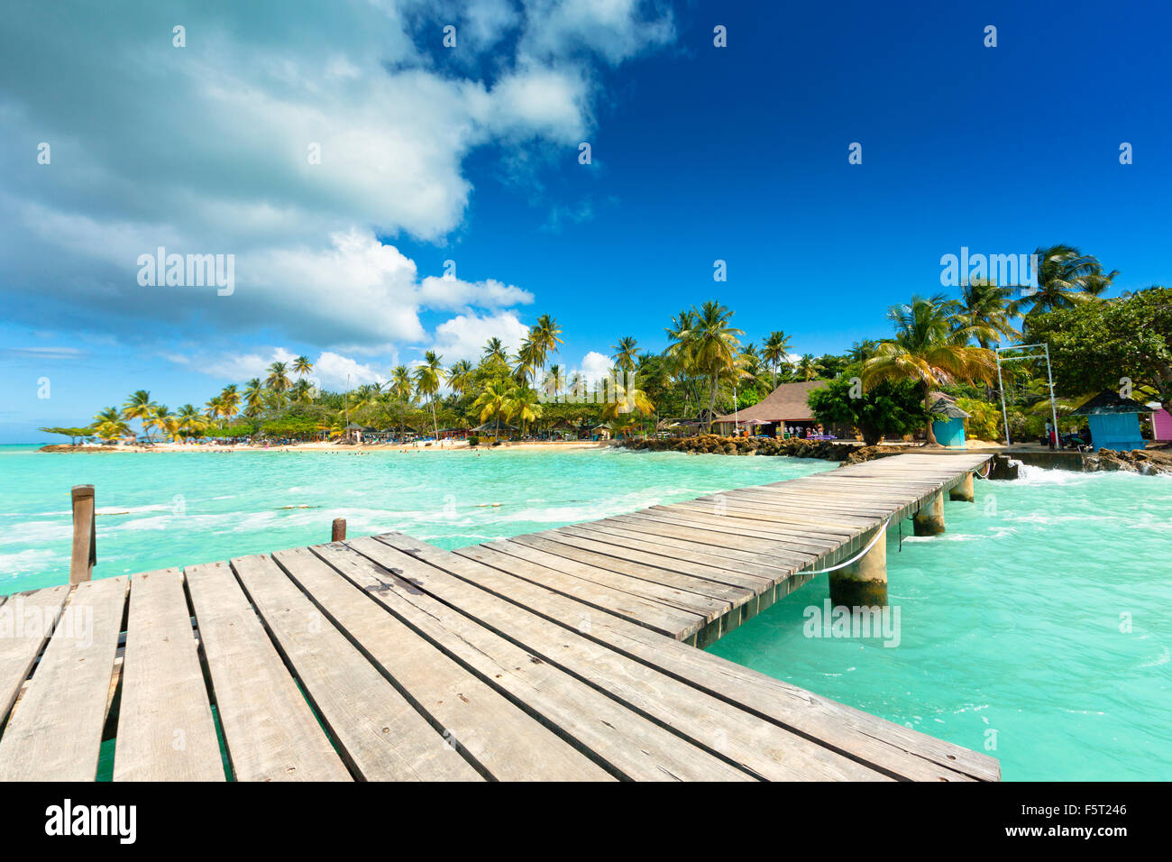 Trinidad and Tobago, Tobago, Pigeon Point, View of wooden pier and coastline Stock Photo