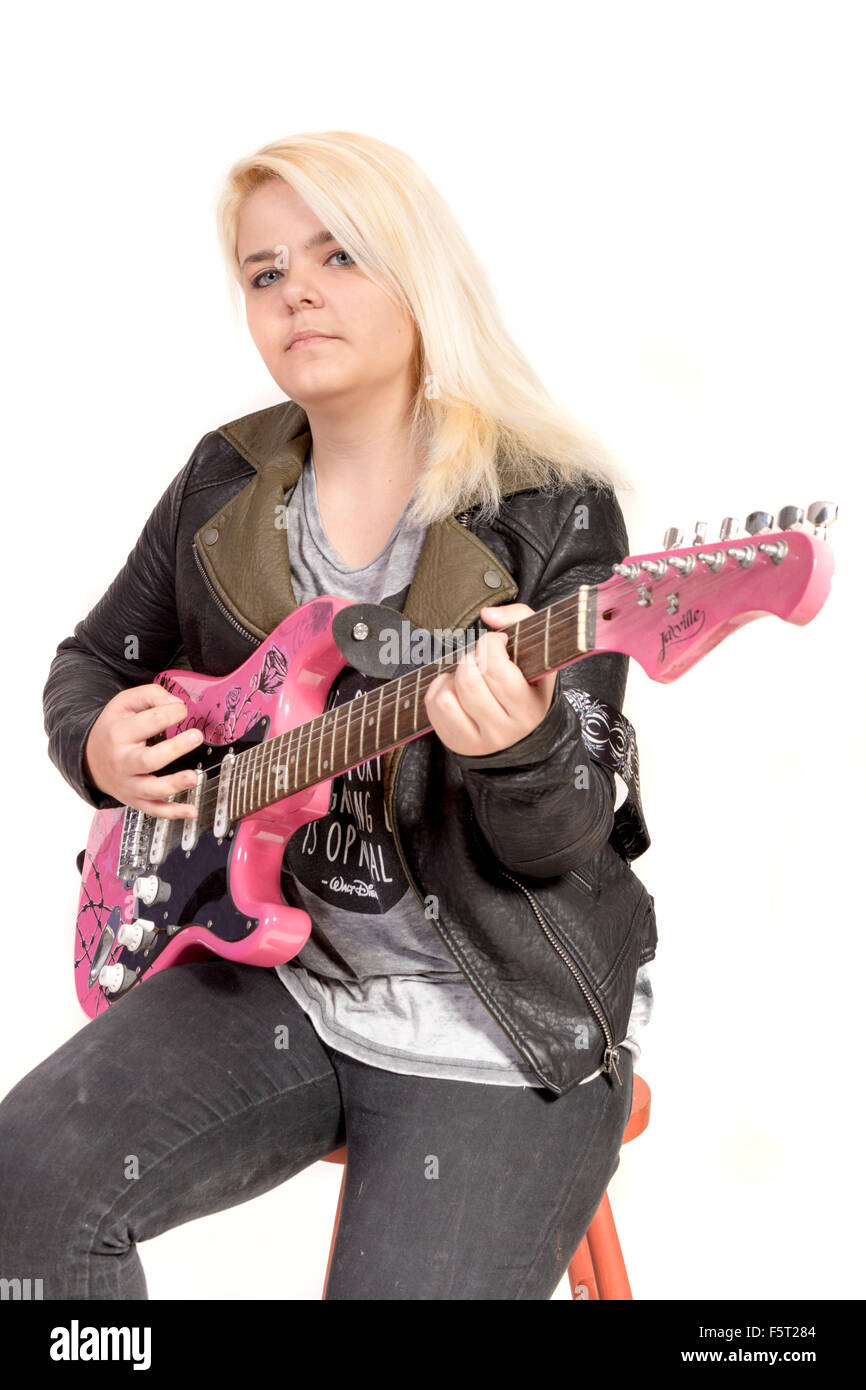 Teenage girl playing electric guitar Stock Photo - Alamy