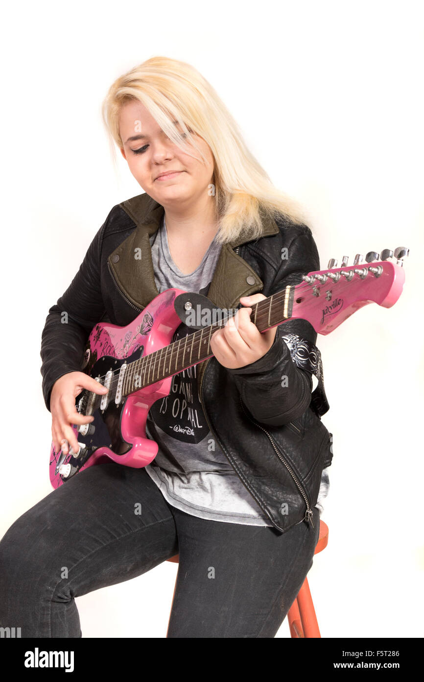 Teenage girl playing electric guitar Stock Photo - Alamy