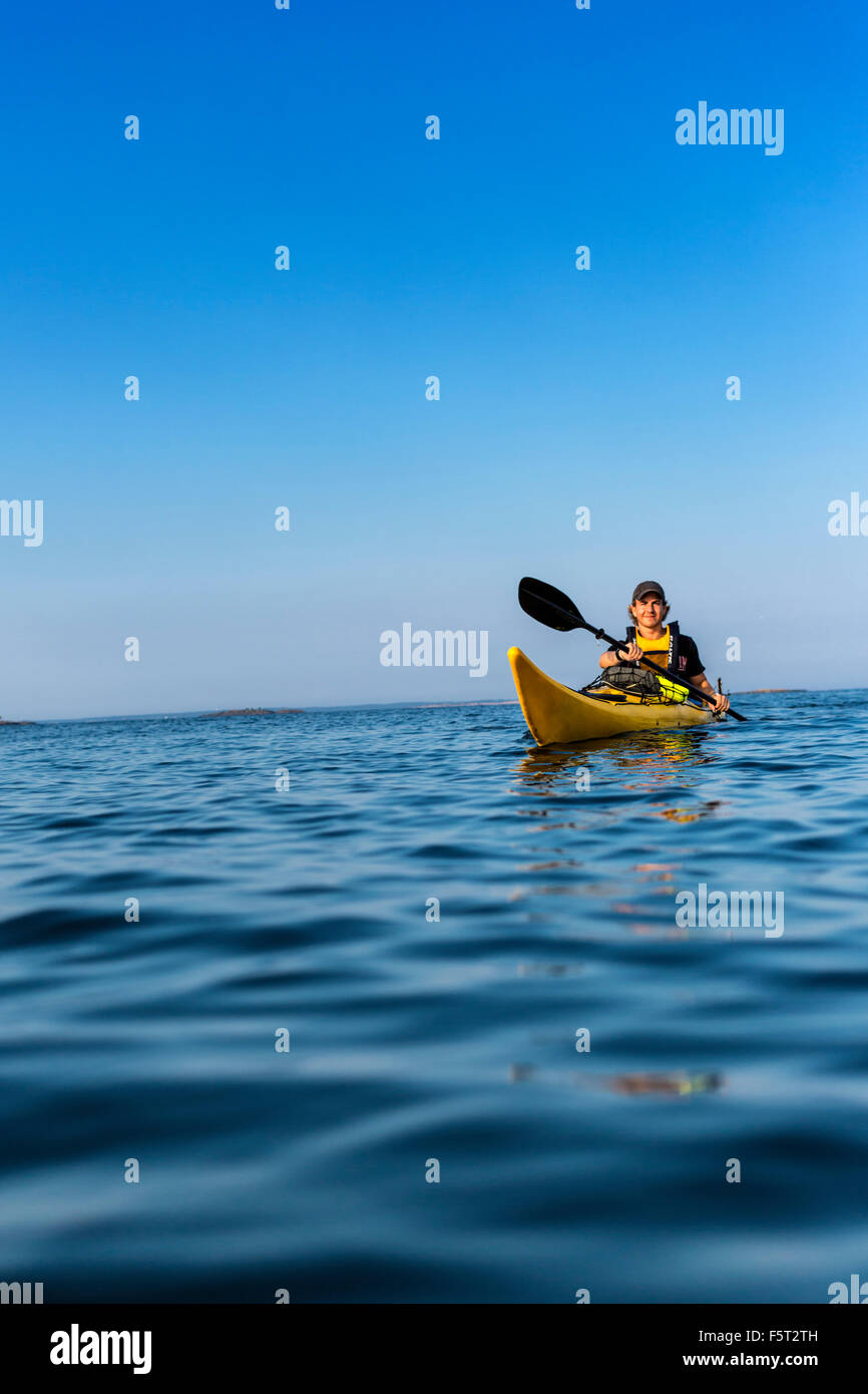 Sweden, Stockholm Archipelago, Teenage boy (16-17) kayaking Stock Photo