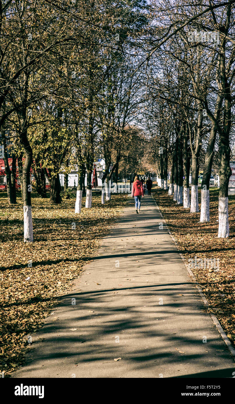Oct. 31, 2015 - Young woman walking away alone the walkaway © Igor Goiovniov/ZUMA Wire/Alamy Live News Stock Photo