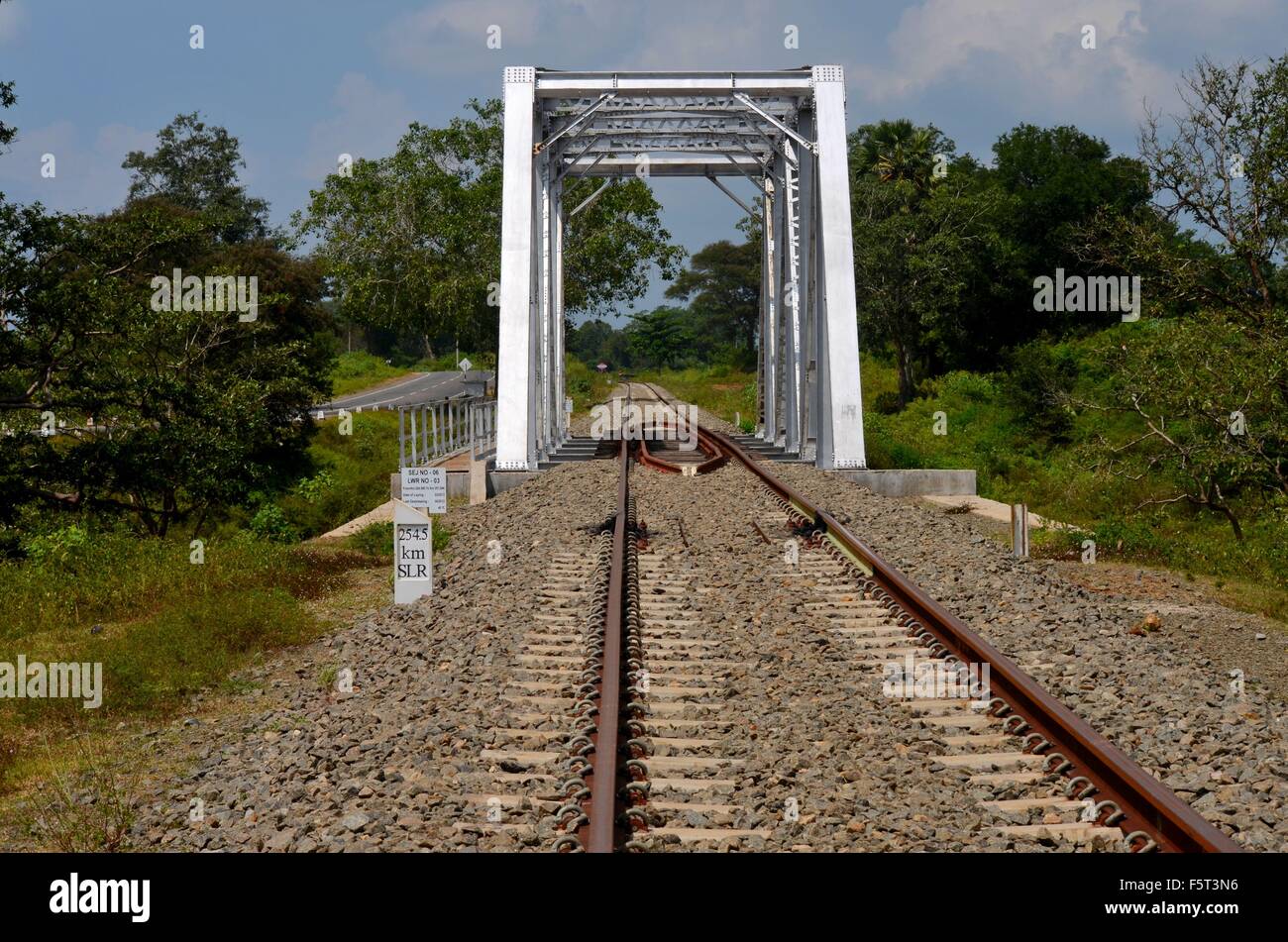 Railway bridge with rail tracks parallel to highway in Sri Lanka Stock Photo Alamy