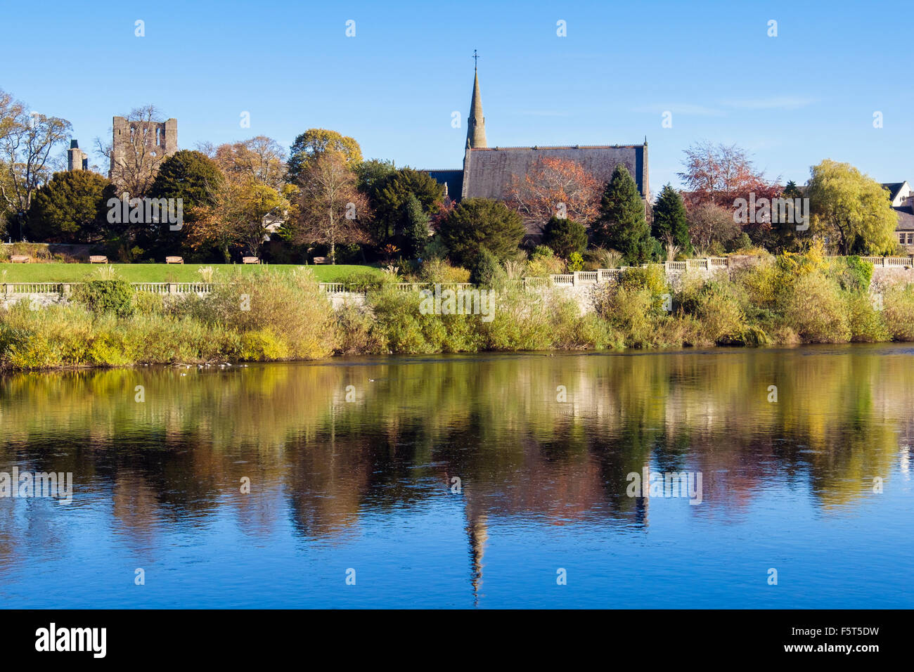Reflections of Abbey and St Andrews church from across the River Tweed. Kelso, Berwickshire Scottish Borders Scotland UK Britain Stock Photo