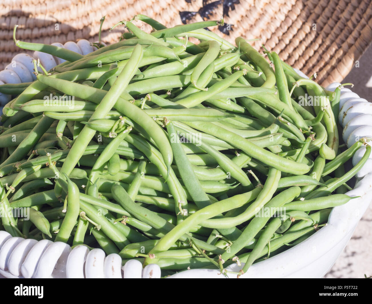 basket of green beans. Fruits and vegetables in season exposed in a street market Stock Photo