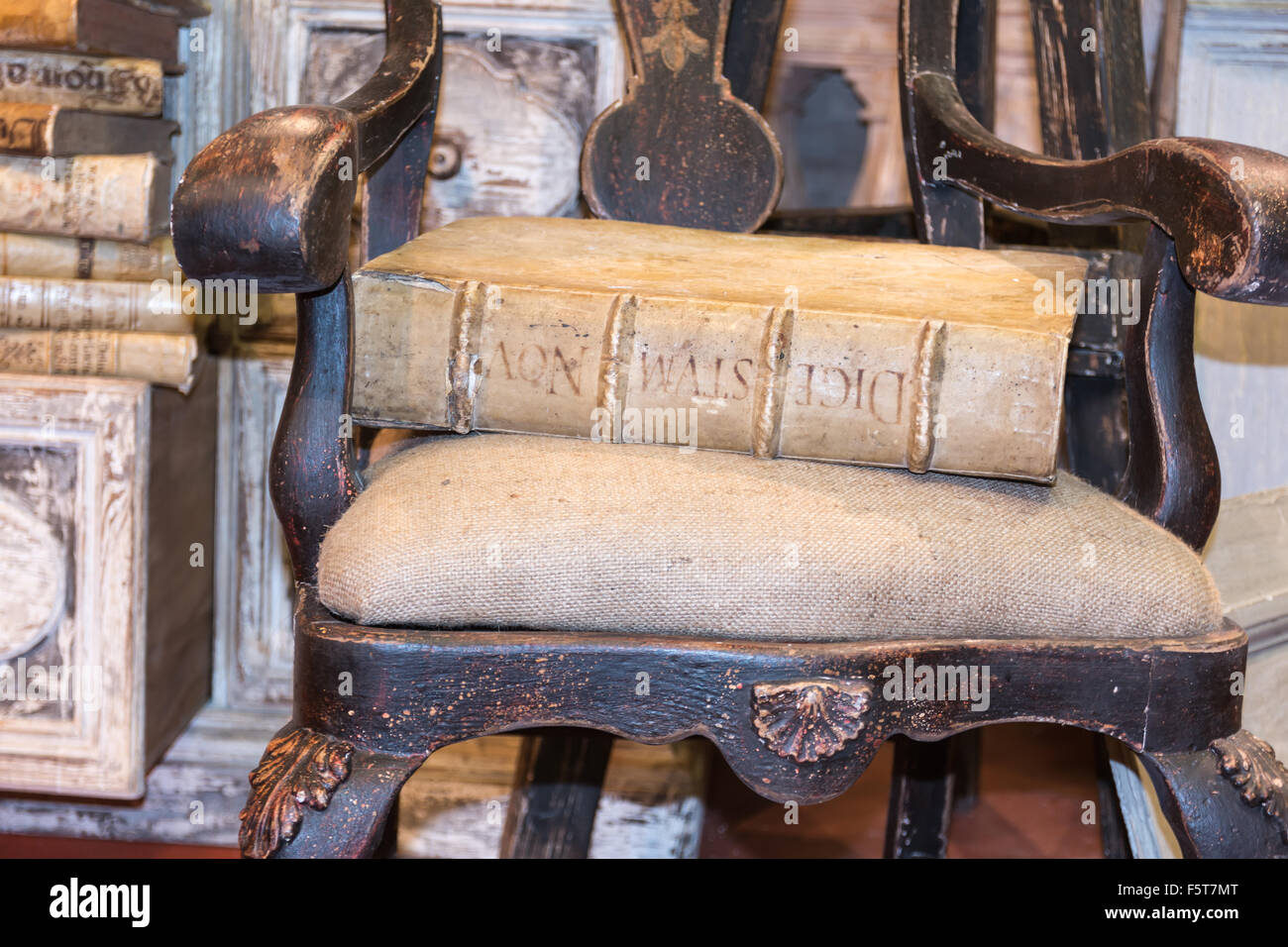 Old antique Latin book on vintage chair Stock Photo Alamy