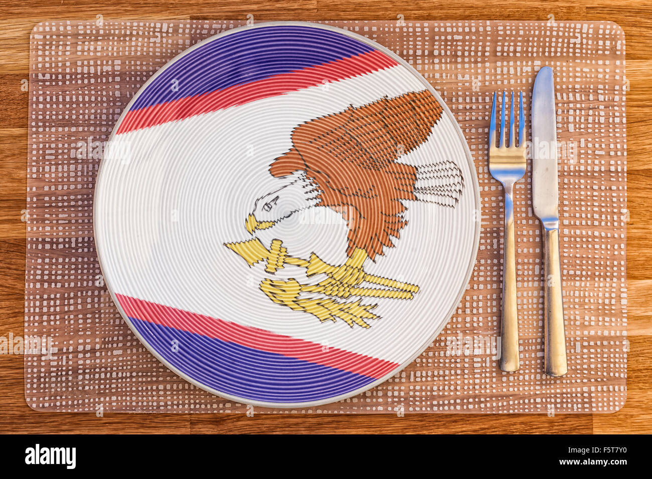 Dinner plate with the flag of American Samoa on it for your international food and drink concepts. Stock Photo