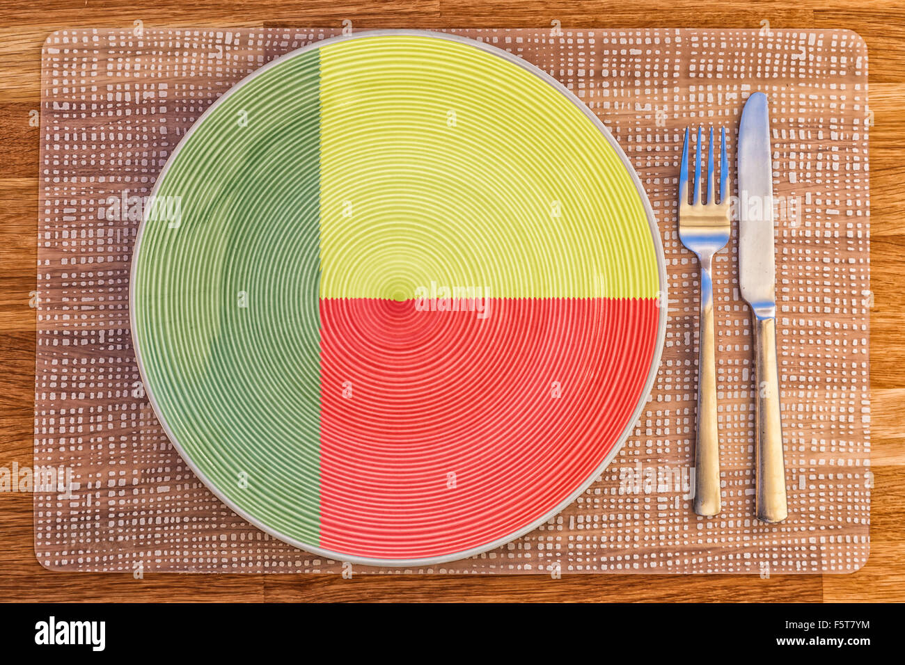 Dinner plate with the flag of Benin on it for your international food and drink concepts. Stock Photo