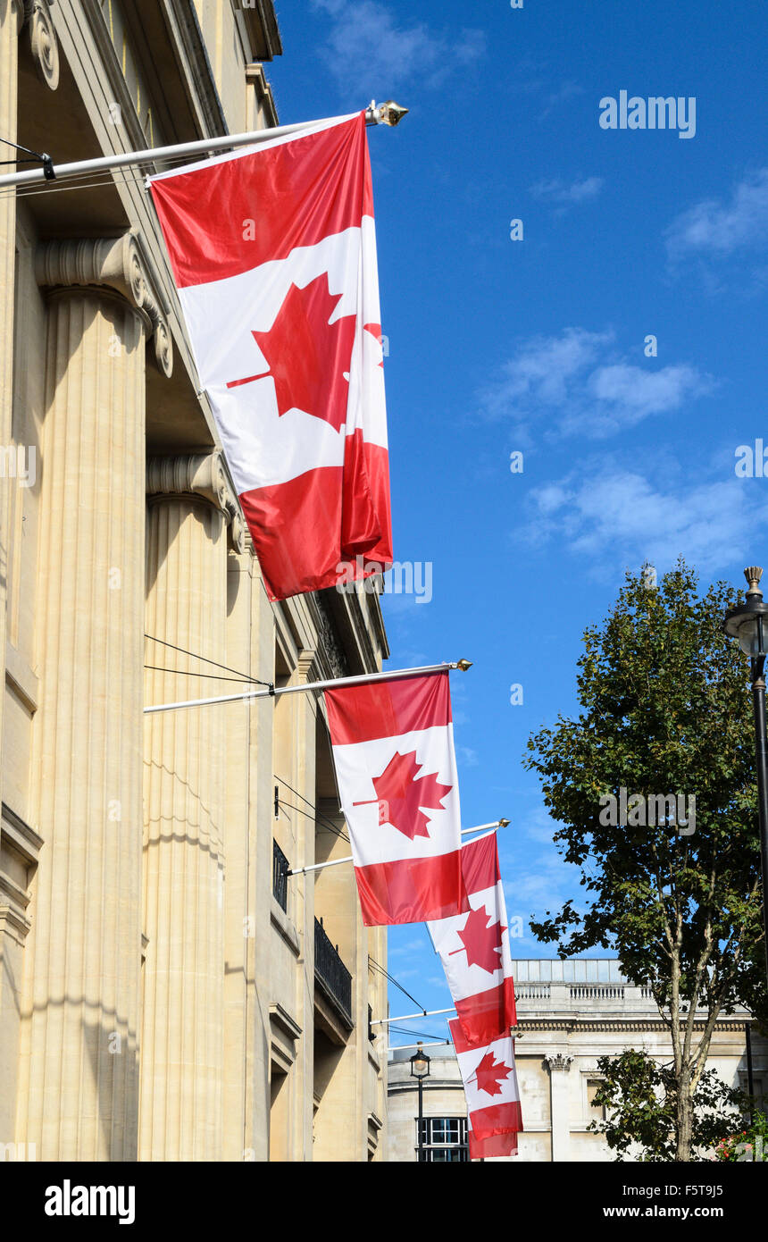 The Canadian Flag hands outside the Canadian Embassy, Trafalgar Square, London, England, UK Stock Photo
