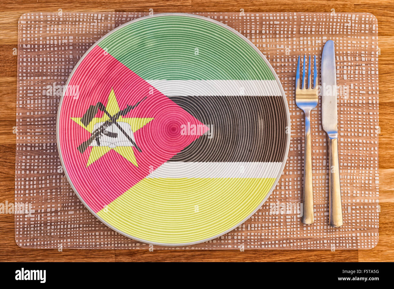 Dinner plate with the flag of Mozambique on it for your international food and drink concepts. Stock Photo