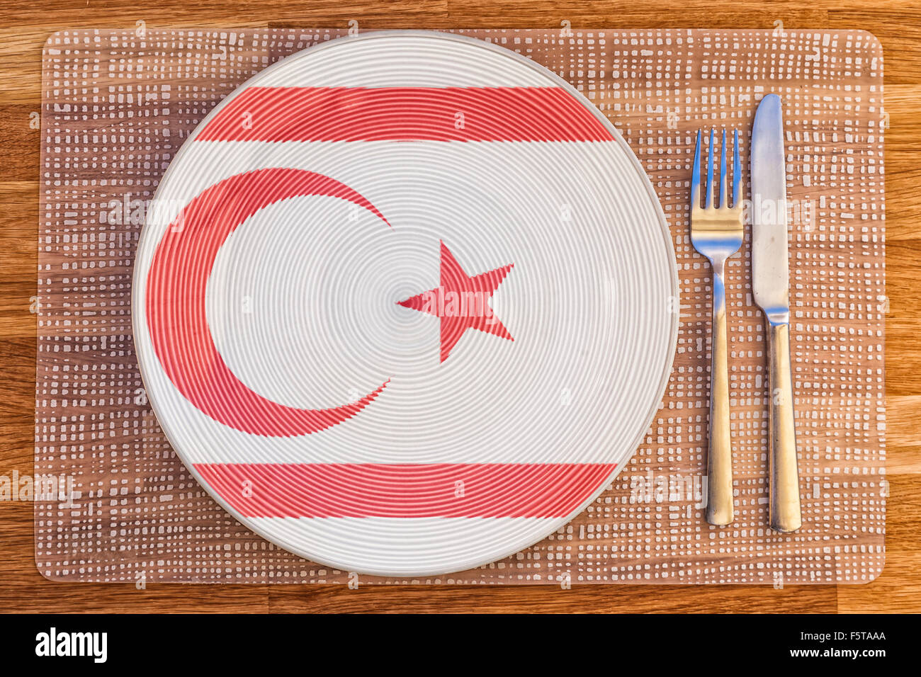 Dinner plate with the flag of Northern Cyprus on it for your international food and drink concepts. Stock Photo