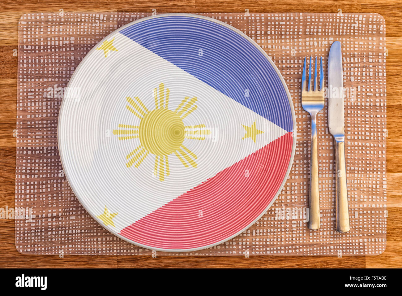 Dinner plate with the flag of Philippines on it for your international food and drink concepts. Stock Photo