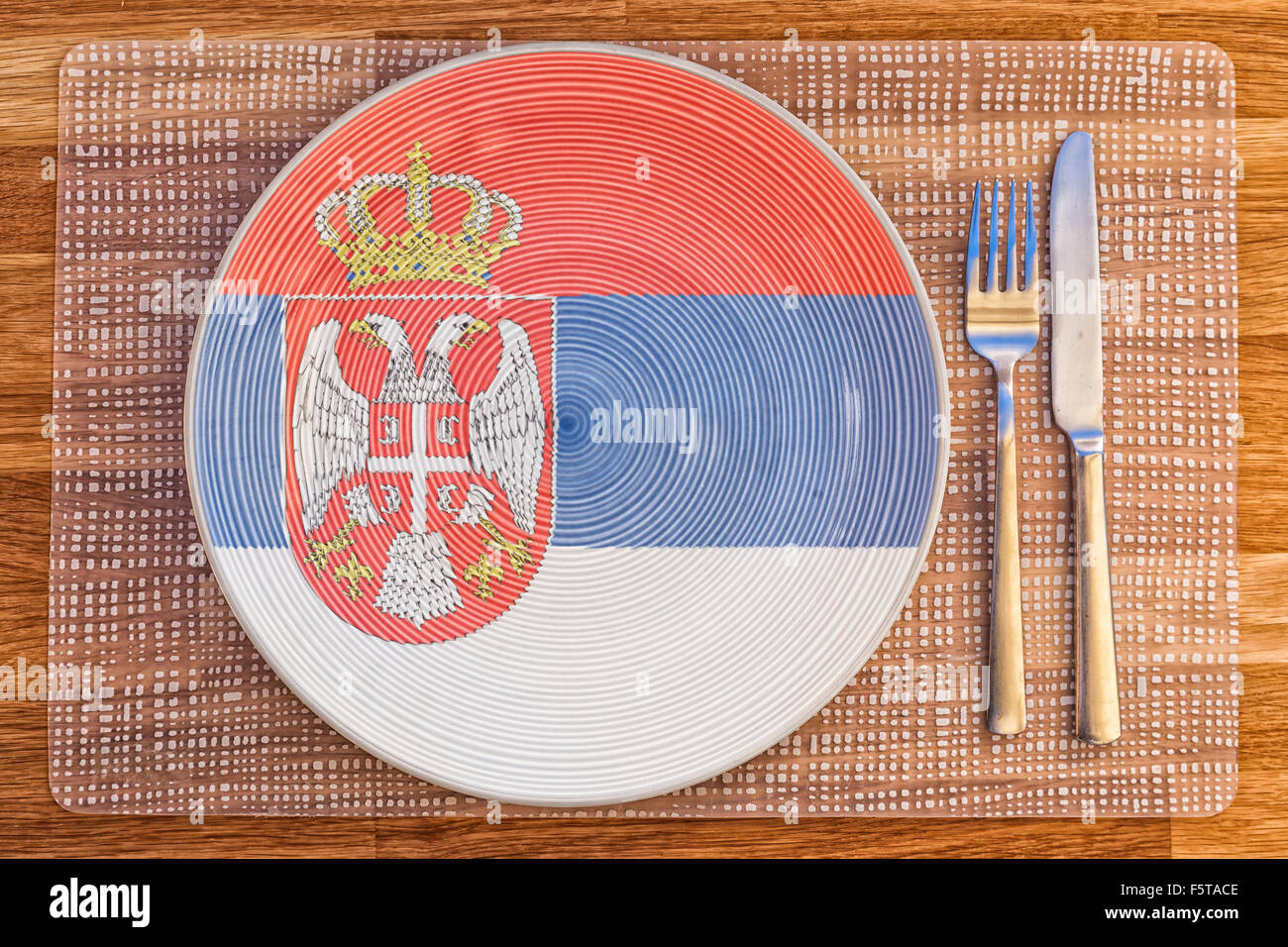 Dinner plate with the flag of Serbia on it for your international food and drink concepts. Stock Photo